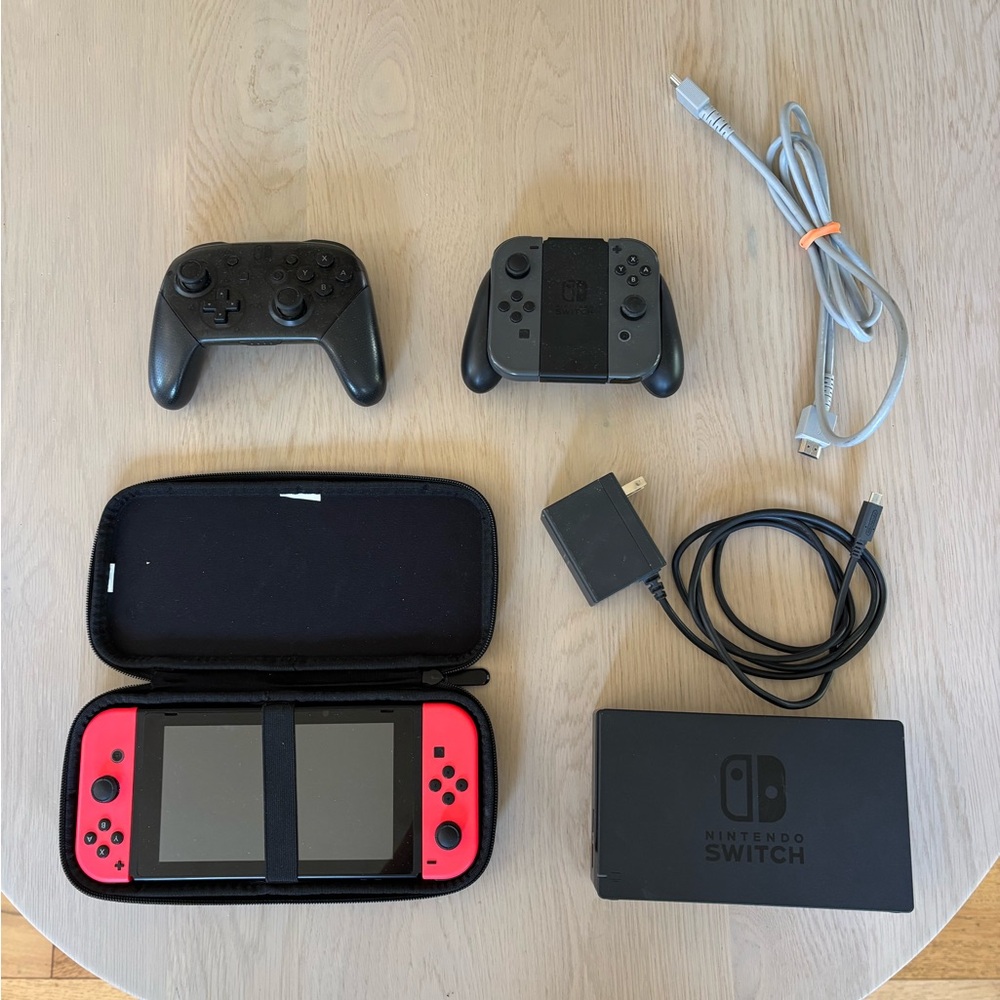 Nintendo Switch Console with Red and Gray Joy-Con Controllers